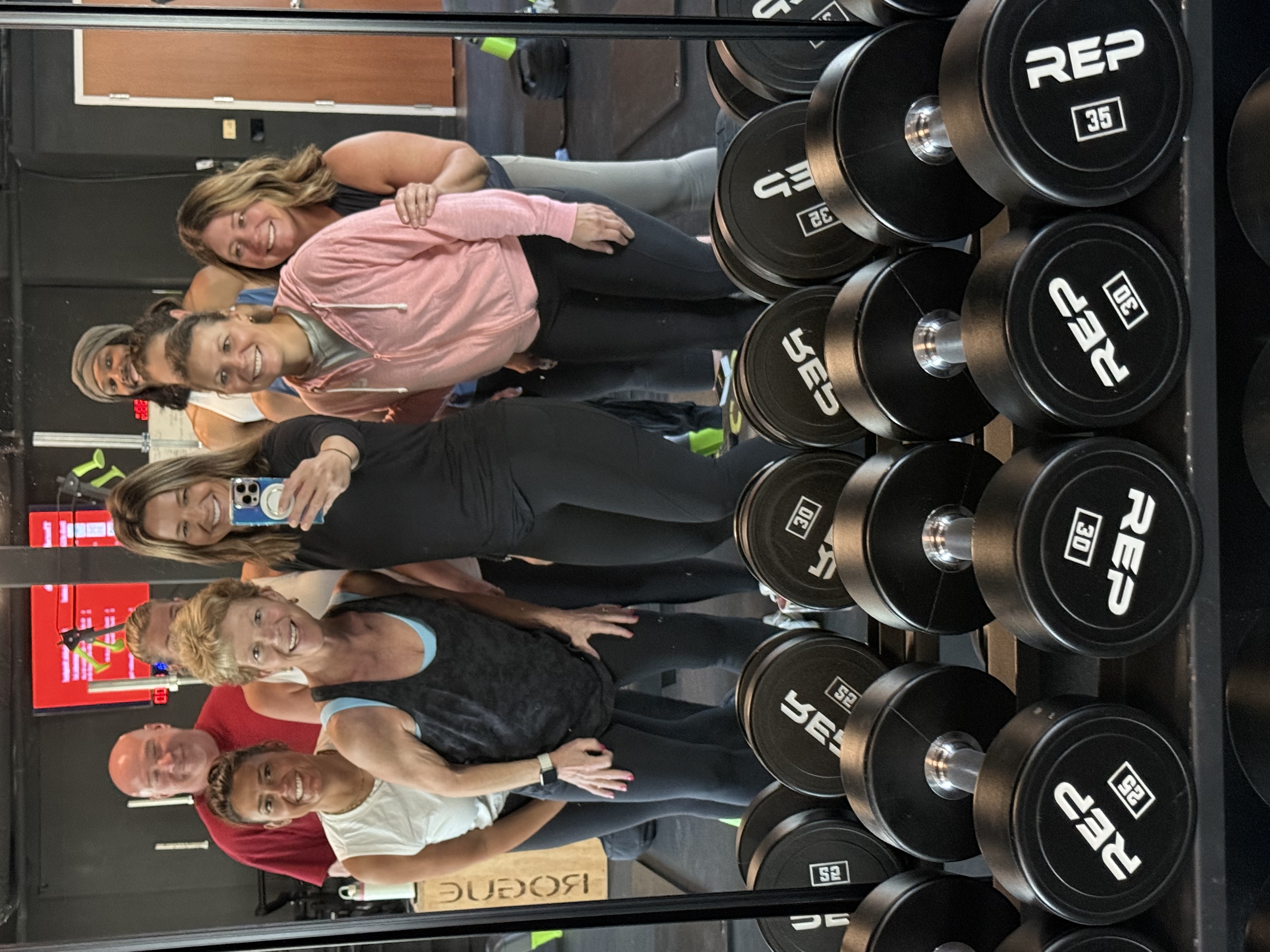 Group fitness class high-fiving